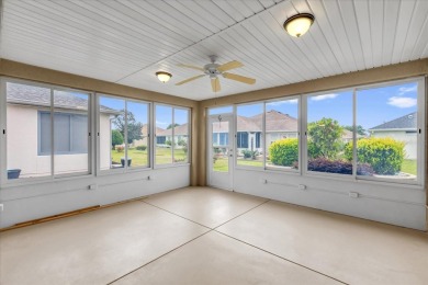 Welcome to this beautifully maintained Challedon model home in on Eagle Ridge At Spruce Creek Country Club in Florida - for sale on GolfHomes.com, golf home, golf lot