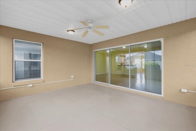 Welcome to this beautifully maintained Challedon model home in on Eagle Ridge At Spruce Creek Country Club in Florida - for sale on GolfHomes.com, golf home, golf lot