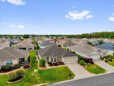 Welcome to this beautifully maintained Challedon model home in on Eagle Ridge At Spruce Creek Country Club in Florida - for sale on GolfHomes.com, golf home, golf lot