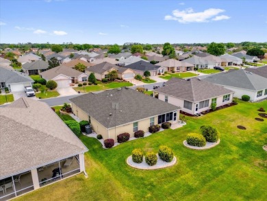 Welcome to this beautifully maintained Challedon model home in on Eagle Ridge At Spruce Creek Country Club in Florida - for sale on GolfHomes.com, golf home, golf lot