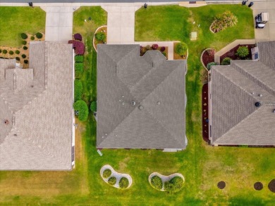 Welcome to this beautifully maintained Challedon model home in on Eagle Ridge At Spruce Creek Country Club in Florida - for sale on GolfHomes.com, golf home, golf lot