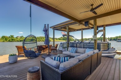 A STORYBOOK HOME ON TELLICO LAKE. 

Tucked into the scenic on Tellico Village -The Links At Kahite Golf Course in Tennessee - for sale on GolfHomes.com, golf home, golf lot