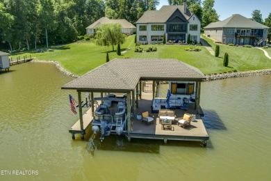 A STORYBOOK HOME ON TELLICO LAKE. 

Tucked into the scenic on Tellico Village -The Links At Kahite Golf Course in Tennessee - for sale on GolfHomes.com, golf home, golf lot