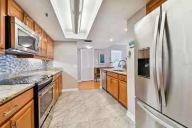 TURNKEY with GOLF & WATERFRONT VIEWS -- This beautifully on Isla Del Sol Yacht and Country Club in Florida - for sale on GolfHomes.com, golf home, golf lot