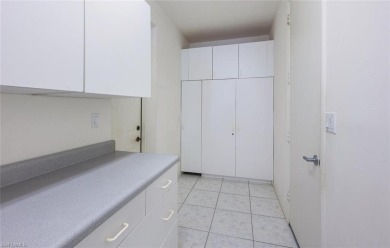 In addition to the 1,630 s/f under air, this attractive 2BR/2BA on Riviera Golf Club in Florida - for sale on GolfHomes.com, golf home, golf lot