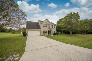 Welcome Home! This beautiful 4-bedroom, 2.5-bath home offers on Eagle Creek Golf Club and Grill in North Carolina - for sale on GolfHomes.com, golf home, golf lot