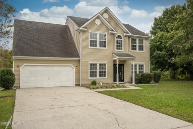 Welcome Home! This beautiful 4-bedroom, 2.5-bath home offers on Eagle Creek Golf Club and Grill in North Carolina - for sale on GolfHomes.com, golf home, golf lot