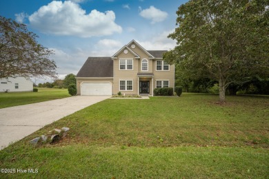 Welcome Home! This beautiful 4-bedroom, 2.5-bath home offers on Eagle Creek Golf Club and Grill in North Carolina - for sale on GolfHomes.com, golf home, golf lot
