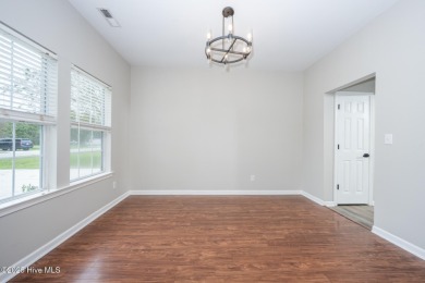 Welcome Home! This beautiful 4-bedroom, 2.5-bath home offers on Eagle Creek Golf Club and Grill in North Carolina - for sale on GolfHomes.com, golf home, golf lot