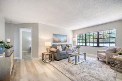 Beautifully renovated villa with private backyard view in Sutton on Highland Lakes Executive Golf Course in Florida - for sale on GolfHomes.com, golf home, golf lot