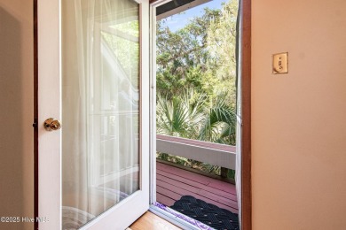 Tucked down a long drive, amid ancient oaks and sabal palms on Bald Head Island Golf Club in North Carolina - for sale on GolfHomes.com, golf home, golf lot