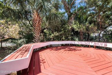 Tucked down a long drive, amid ancient oaks and sabal palms on Bald Head Island Golf Club in North Carolina - for sale on GolfHomes.com, golf home, golf lot