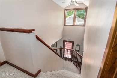 Tucked down a long drive, amid ancient oaks and sabal palms on Bald Head Island Golf Club in North Carolina - for sale on GolfHomes.com, golf home, golf lot