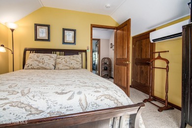 Tucked down a long drive, amid ancient oaks and sabal palms on Bald Head Island Golf Club in North Carolina - for sale on GolfHomes.com, golf home, golf lot