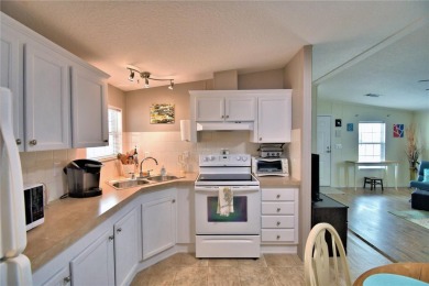 WELCOME TO YOUR FLORIDA RETIREMENT OASIS IN A GATED 55+COMMUNITY on Southern Dunes Golf and Country Club in Florida - for sale on GolfHomes.com, golf home, golf lot