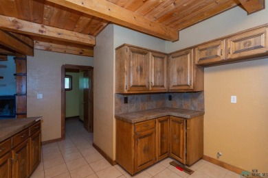 Welcome home! This charming 3-bedroom, 2-bath home is full of on Roswell Country Club in New Mexico - for sale on GolfHomes.com, golf home, golf lot
