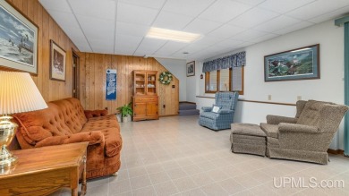 Custom-built home on the 16th green of top-rated Timberstone on TimberStone At Pine Mountain in Michigan - for sale on GolfHomes.com, golf home, golf lot