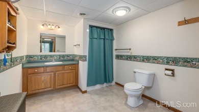 Custom-built home on the 16th green of top-rated Timberstone on TimberStone At Pine Mountain in Michigan - for sale on GolfHomes.com, golf home, golf lot