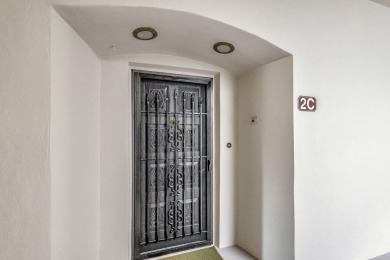SPACIOUS ONE BEDROOM CONDO OVERLOOKING THE COURTYARD WITH ONE on BallenIsles Golf and Country Club in Florida - for sale on GolfHomes.com, golf home, golf lot