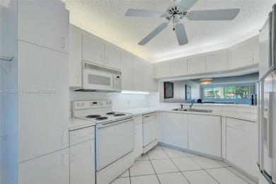 Boasting 1,420 square feet of living space, the condo features a on Sunrise Lakes Phase IV Golf Course in Florida - for sale on GolfHomes.com, golf home, golf lot