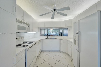 Boasting 1,420 square feet of living space, the condo features a on Sunrise Lakes Phase IV Golf Course in Florida - for sale on GolfHomes.com, golf home, golf lot