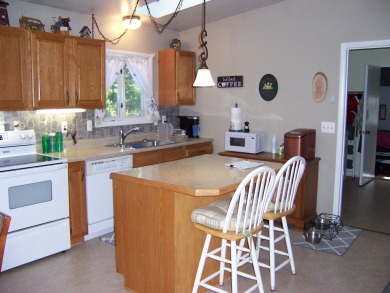 Double Lot, Year round home on private, wooded setting. Located on Burning Oak Country Club in Michigan - for sale on GolfHomes.com, golf home, golf lot