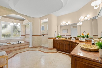 Welcome to this exquisite former model home custom built by on Bayou Golf Club in Florida - for sale on GolfHomes.com, golf home, golf lot