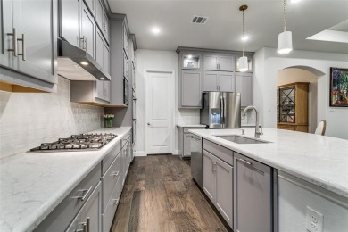 Step into refined luxury with this exquisite one-story residence on The Tribute At the Colony in Texas - for sale on GolfHomes.com, golf home, golf lot