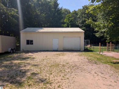 Charming Home Just 15 Minutes from Traverse City!  This on Interlochen Golf and Country Club in Michigan - for sale on GolfHomes.com, golf home, golf lot