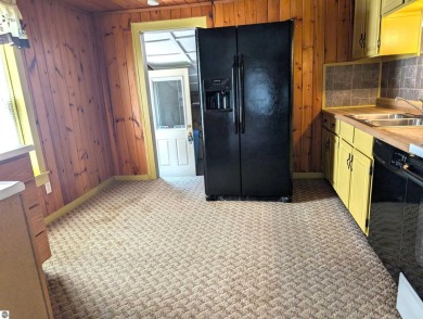 Charming Home Just 15 Minutes from Traverse City!  This on Interlochen Golf and Country Club in Michigan - for sale on GolfHomes.com, golf home, golf lot