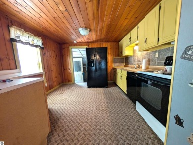 Charming Home Just 15 Minutes from Traverse City!  This on Interlochen Golf and Country Club in Michigan - for sale on GolfHomes.com, golf home, golf lot