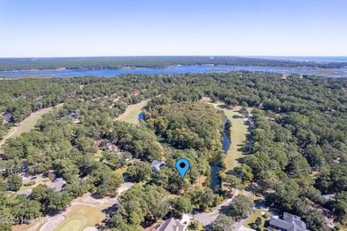 Build your coastal retreat on this .33-acre waterfront lot in on Lockwood Folly Country Club in North Carolina - for sale on GolfHomes.com, golf home, golf lot
