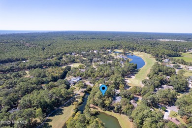 Build your coastal retreat on this .33-acre waterfront lot in on Lockwood Folly Country Club in North Carolina - for sale on GolfHomes.com, golf home, golf lot
