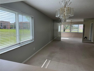 Discover the potential of this spacious 2 BR, 2 BTH corner condo on Sunrise Lakes Phase III in Florida - for sale on GolfHomes.com, golf home, golf lot