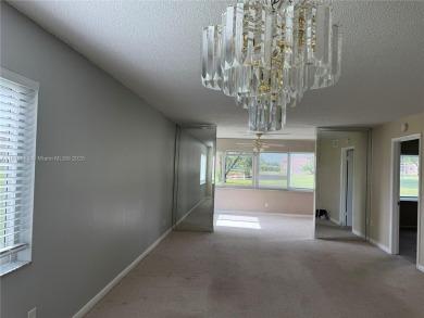 Discover the potential of this spacious 2 BR, 2 BTH corner condo on Sunrise Lakes Phase III in Florida - for sale on GolfHomes.com, golf home, golf lot
