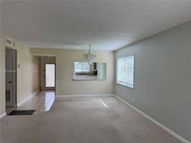 Discover the potential of this spacious 2 BR, 2 BTH corner condo on Sunrise Lakes Phase III in Florida - for sale on GolfHomes.com, golf home, golf lot