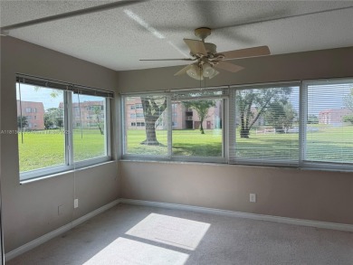 Discover the potential of this spacious 2 BR, 2 BTH corner condo on Sunrise Lakes Phase III in Florida - for sale on GolfHomes.com, golf home, golf lot