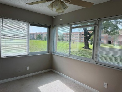 Discover the potential of this spacious 2 BR, 2 BTH corner condo on Sunrise Lakes Phase III in Florida - for sale on GolfHomes.com, golf home, golf lot