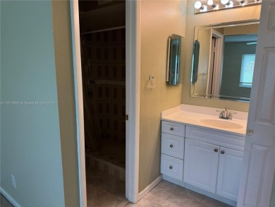 Discover the potential of this spacious 2 BR, 2 BTH corner condo on Sunrise Lakes Phase III in Florida - for sale on GolfHomes.com, golf home, golf lot