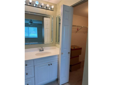 Discover the potential of this spacious 2 BR, 2 BTH corner condo on Sunrise Lakes Phase III in Florida - for sale on GolfHomes.com, golf home, golf lot