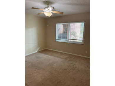 Discover the potential of this spacious 2 BR, 2 BTH corner condo on Sunrise Lakes Phase III in Florida - for sale on GolfHomes.com, golf home, golf lot