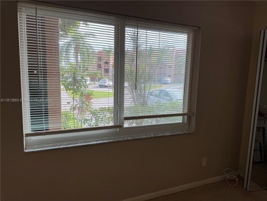 Discover the potential of this spacious 2 BR, 2 BTH corner condo on Sunrise Lakes Phase III in Florida - for sale on GolfHomes.com, golf home, golf lot