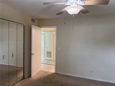 Discover the potential of this spacious 2 BR, 2 BTH corner condo on Sunrise Lakes Phase III in Florida - for sale on GolfHomes.com, golf home, golf lot