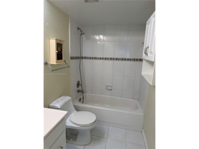 Discover the potential of this spacious 2 BR, 2 BTH corner condo on Sunrise Lakes Phase III in Florida - for sale on GolfHomes.com, golf home, golf lot