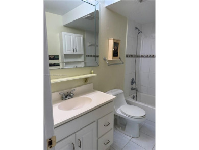 Discover the potential of this spacious 2 BR, 2 BTH corner condo on Sunrise Lakes Phase III in Florida - for sale on GolfHomes.com, golf home, golf lot