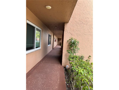 Discover the potential of this spacious 2 BR, 2 BTH corner condo on Sunrise Lakes Phase III in Florida - for sale on GolfHomes.com, golf home, golf lot