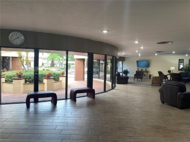 Discover the potential of this spacious 2 BR, 2 BTH corner condo on Sunrise Lakes Phase III in Florida - for sale on GolfHomes.com, golf home, golf lot