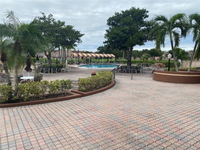 Discover the potential of this spacious 2 BR, 2 BTH corner condo on Sunrise Lakes Phase III in Florida - for sale on GolfHomes.com, golf home, golf lot