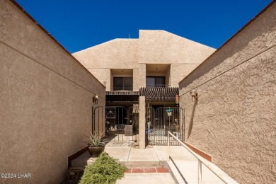 This golf course townhome is the perfect worry-free, lock and on London Bridge Golf Course in Arizona - for sale on GolfHomes.com, golf home, golf lot