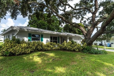 This beautiful renovated block-constructed home is in the 55+ on Mainlands Golf Club in Florida - for sale on GolfHomes.com, golf home, golf lot